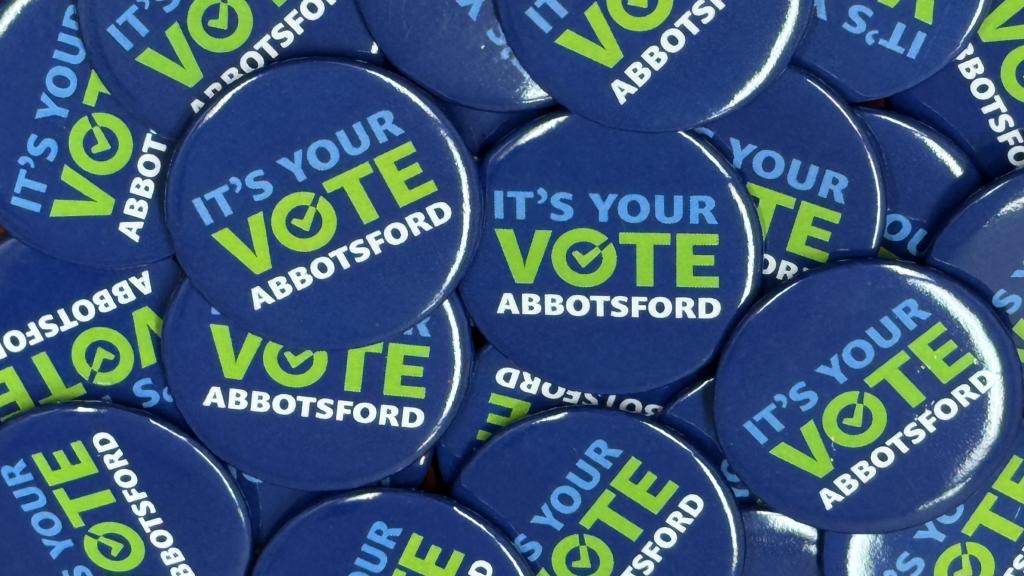 Buttons with the words "It's your vote Abbotsford" written on them.