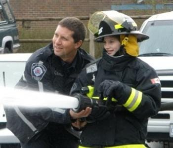 Student using fire hose