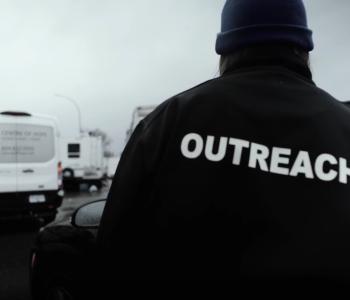 An outreach worker attends an encampment on Ministry of Transportation and Transit property where many struggle with substance use issues.