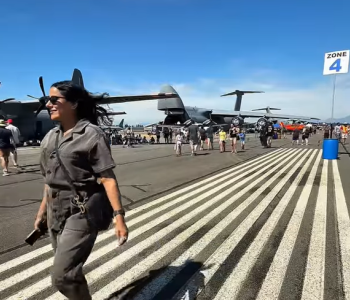 Girl walking on airport tarmac