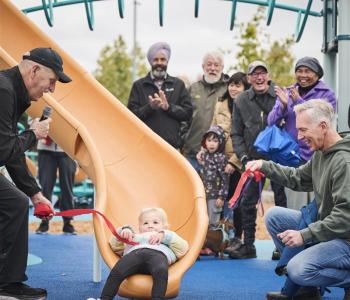 Girl sliding down a slide at playground