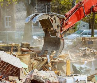 Image of house being demolished