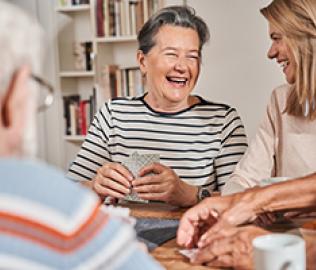 ladies laughing playing cards