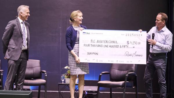 Mayor Siemens presents a cheque for $4,150 in support of the BC Aviation Council scholarship program.
