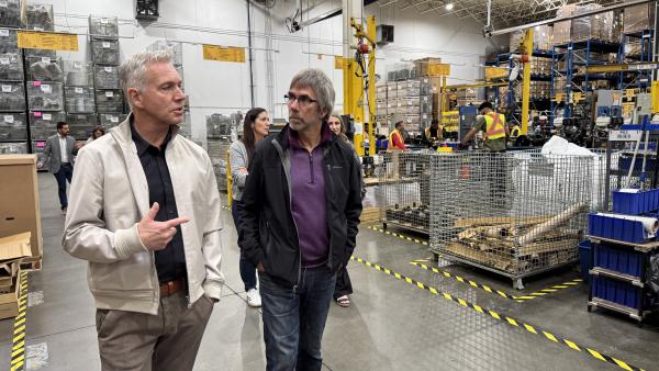The Mayor and tour participants walk through BE Power Equipment.
