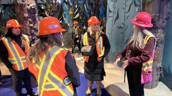 Colleen Miller leads Councillors Ross, Driessen and Chahal through the Underwater Adventure Golf course.