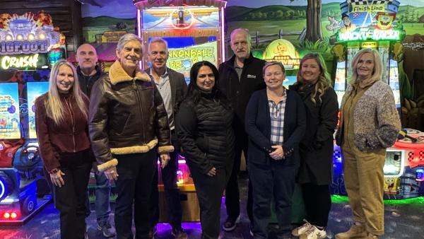 Mayor and Council with Castle Fun Park co-owners Colleen Miller and Brian Wiebe, and business development manager Sue Bossley, in the arcade after the tour.