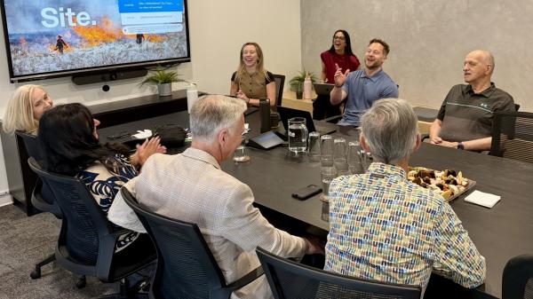 SitePartners president Andrew Hansen, with chief of staff Taylor Almeida and office coordinator Anmol Dhindsa, speaks with City Council in the conference room.
